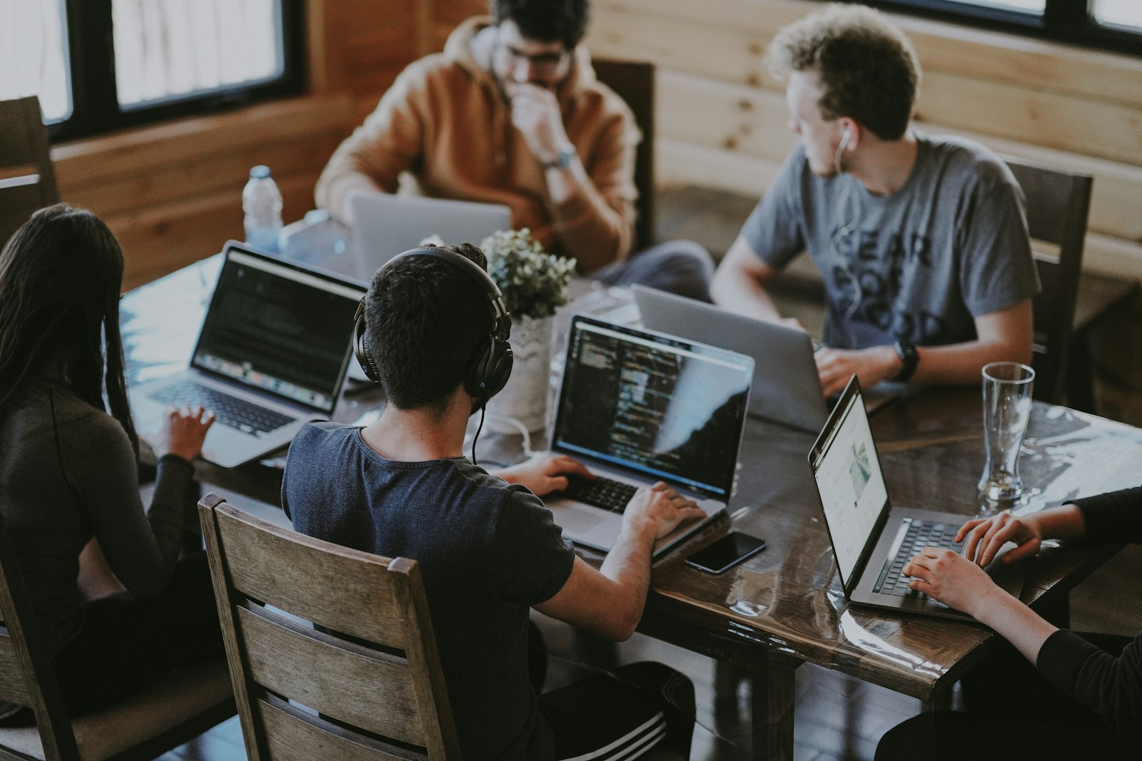 Team members sharing company content on their own channels