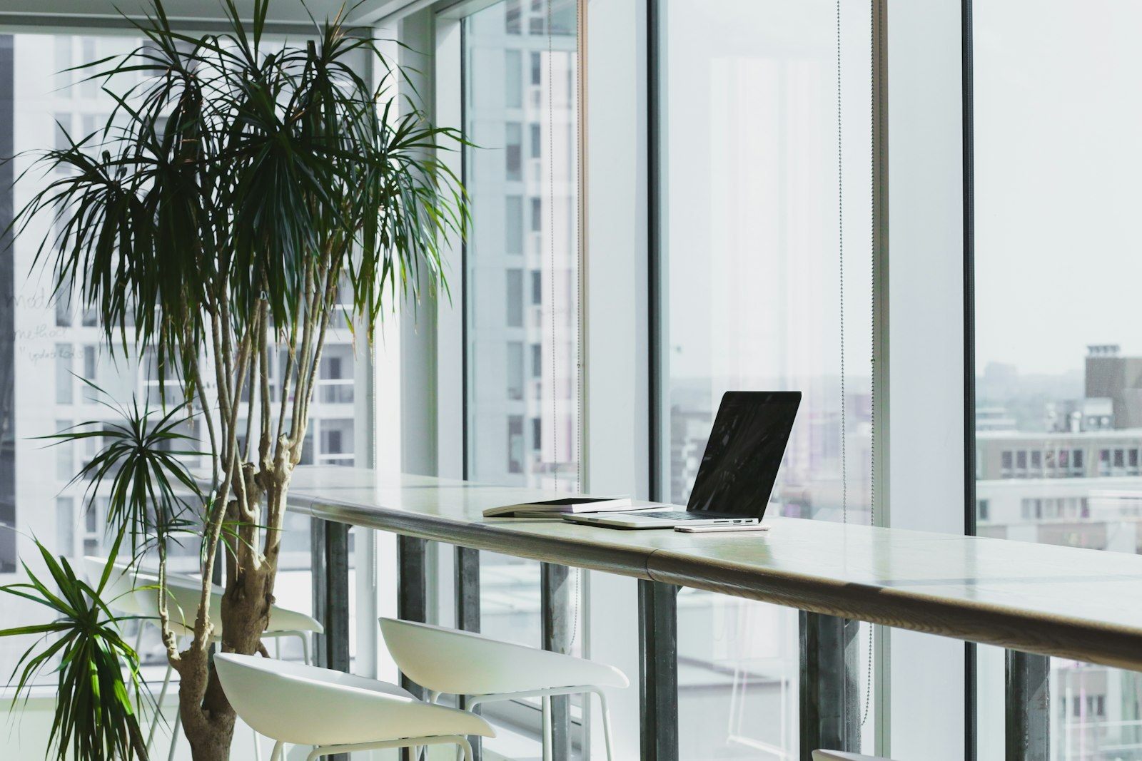 Bright workspace with a laptop ready for reviewing performance